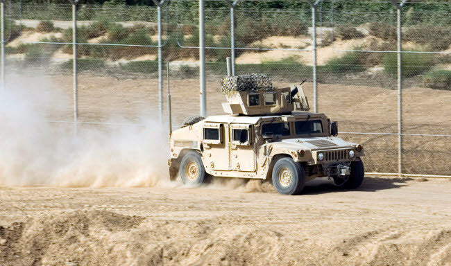 A M1114 Humvee Patrols Joint Base Balad, Iraq Fine Art Print by Stocktrek Images