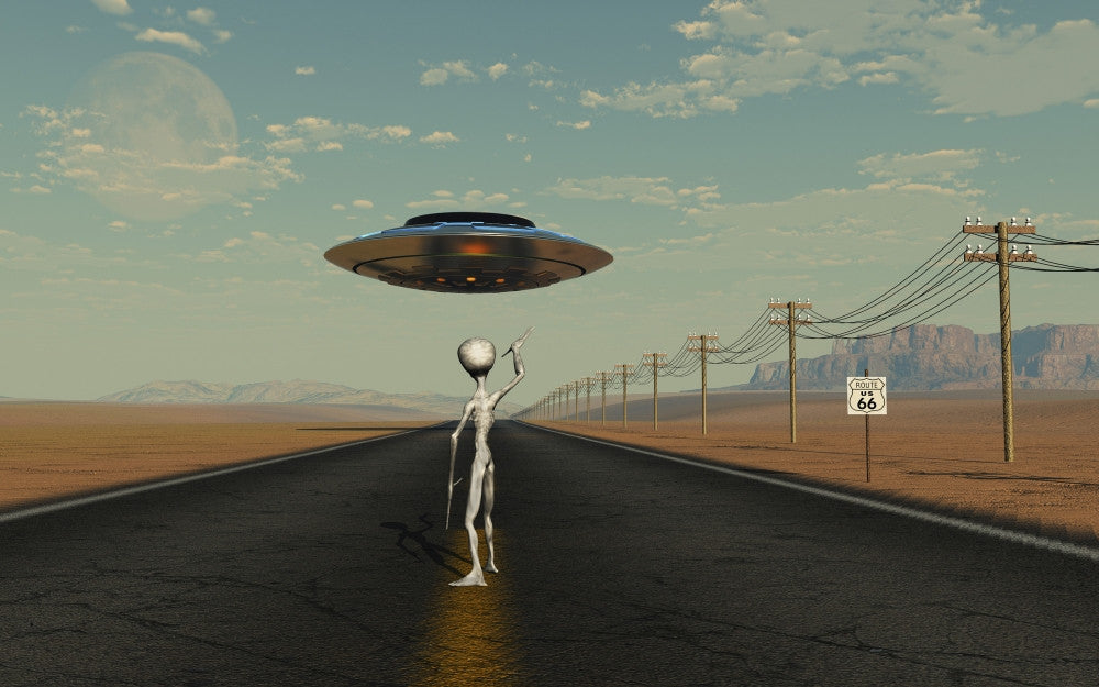 A Grey Alien Hitching a Ride from a Passing UFO Poster Print