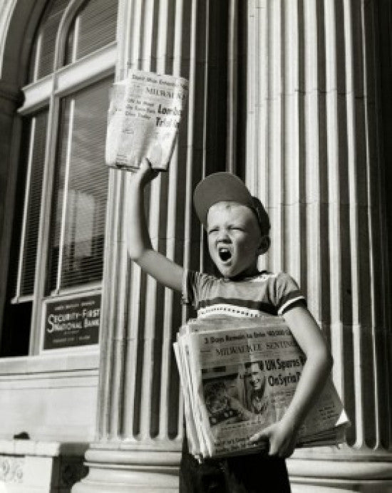 Boy Selling Newspapers in Front of a Building Fine Art Print