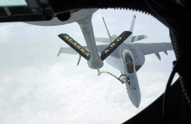A Navy F/A-18F Super Hornet Refueled by KC-135R Stratotanker Fine Art Print by Stocktrek Images