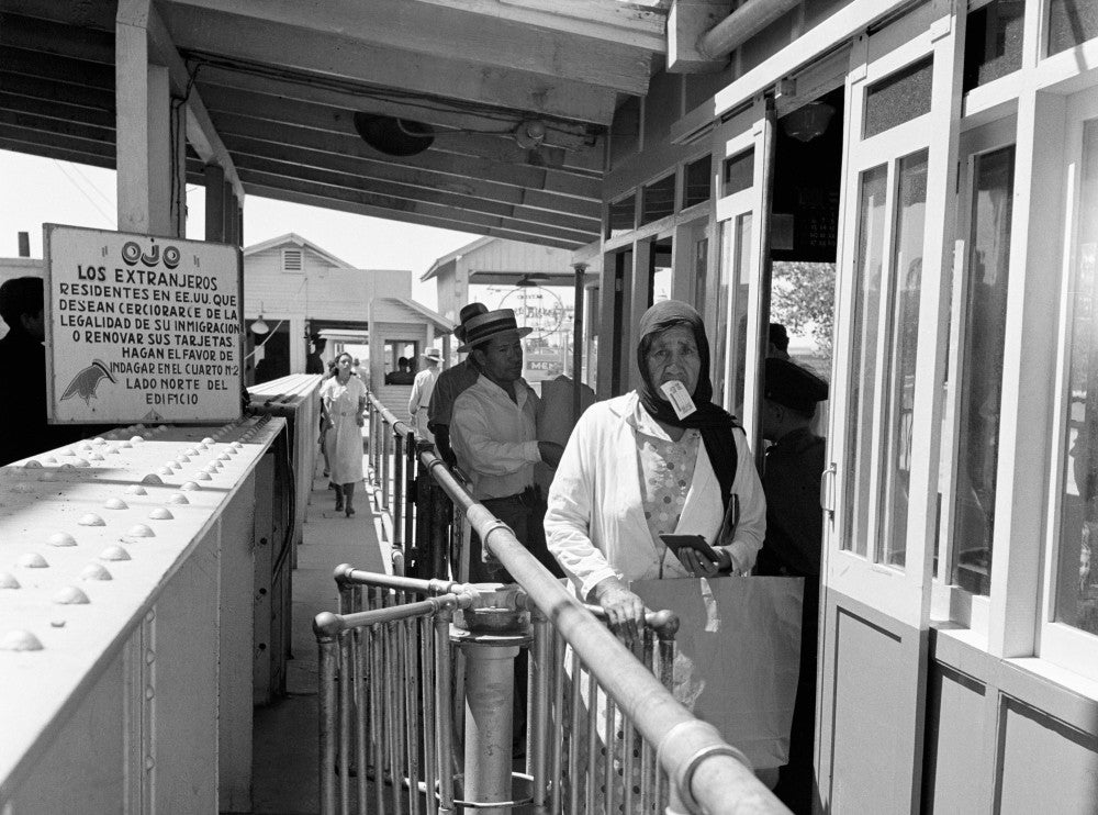 Mexican Immigrants Entering the U.S. Immigration Station - Photograph by Dorothea Lange