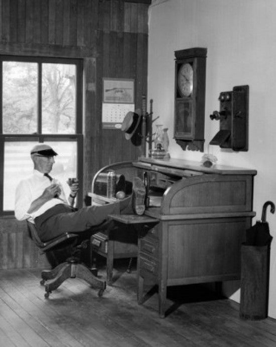 Senior Man Sitting with Feet on Desk Fine Art Print