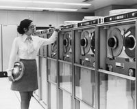 Businesswoman Working with Computer Tape Drives - 1970 Fine Art Print