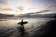 Silhouette of a Surfer with Surfboard at Sunset Fine Art Print by Scott Dickerson