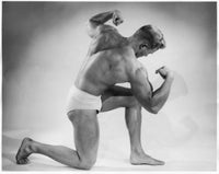 Side Profile of Young Man Flexing Muscles Fine Art Print