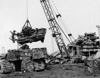 Crane Carrying a Damaged Car at a Junkyard Fine Art Print