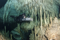 Diver Using Side Mount Gear in Cave in Mexico Fine Art Print