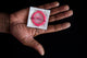 Human Hand Holding Male Condom Fine Art Print by VWPics