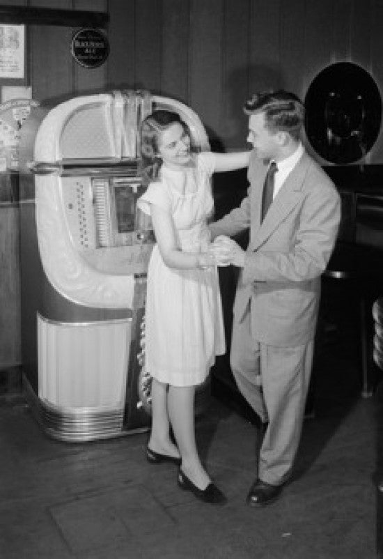 Young Couple Dancing by Jukebox in Bar Fine Art Print