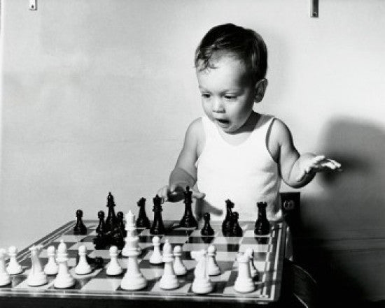 Close-up of a Boy Playing Chess Fine Art Print