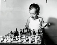 Close-up of a Boy Playing Chess Fine Art Print