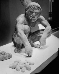 Statue of a Caveman Using Stones to Calculate Fine Art Print