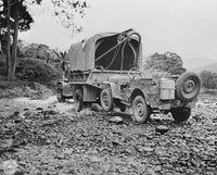 A US Military Truck with Wrecker Mount Towing a Jeep, 1942 Fine Art Print by Stocktrek Images