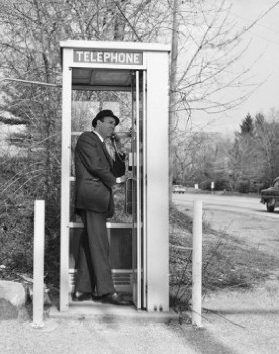 Side Profile of a Businessman Talking on a Pay Phone Fine Art Print