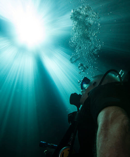 Scuba Diver Surfacing Fine Art Print by Michael Wood | Stocktrek Images