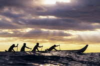 Outrigger Canoe and Paddlers at Sunset Fine Art Print by Vince Cavataio