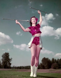 Majorette Twirling Baton Poster Print - Low Angle View