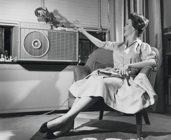 Young Woman Operating Air Conditioner Fine Art Print