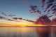 Vivid Sunrise Clouds Over Fort Peck Reservoir Art Print by Chuck Haney