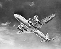 Douglas DC-7 Airplane Flying in the Sky Fine Art Print