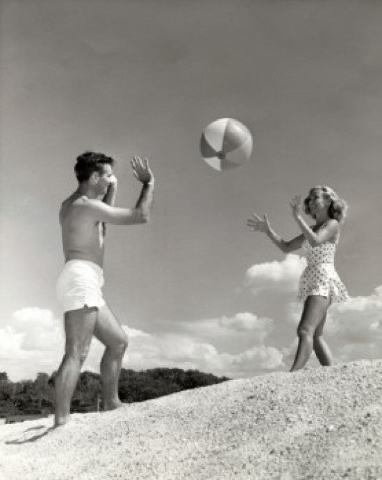 Young Couple Playing with a Beach Ball Fine Art Print