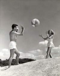 Young Couple Playing with a Beach Ball Fine Art Print