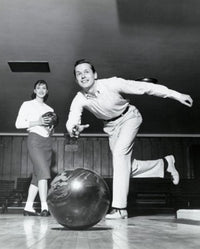 Young Man Bowling Fine Art Print with Woman in Alley