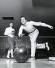 Young Man Bowling Fine Art Print with Woman in Alley