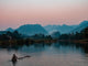Lone Man on Raft at Sunset in Pu Luong Nature Reserve Fine Art Print by Bryce Merrill