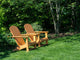 Pair of Adirondack Chairs in a Garden Fine Art Print by Julie Eggers
