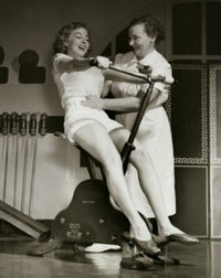 Young Woman Exercising on an Exercise Bike Poster Print