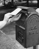 Close-Up Poster Print of Hand Dropping Letter into Mailbox