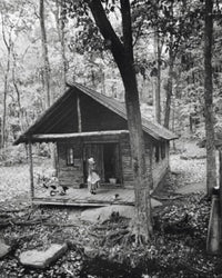Woman with Dog on Log Cabin Porch Fine Art Print