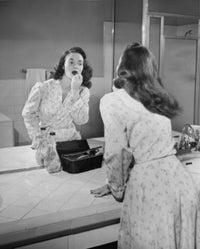 Reflection of a Young Woman Applying Lipstick Fine Art Print
