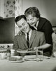Young Woman Serving Steak to a Young Man Fine Art Print