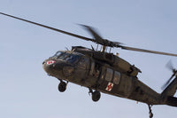 A UH-60 Blackhawk Medivac Helicopter Over Camp Warhorse Fine Art Print by Terry Moore