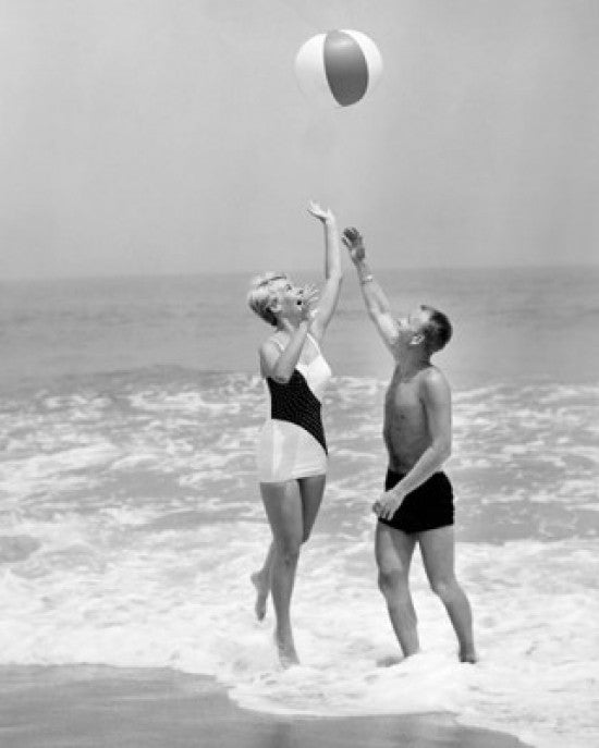 Young Couple Playing with Beach Ball Fine Art Print