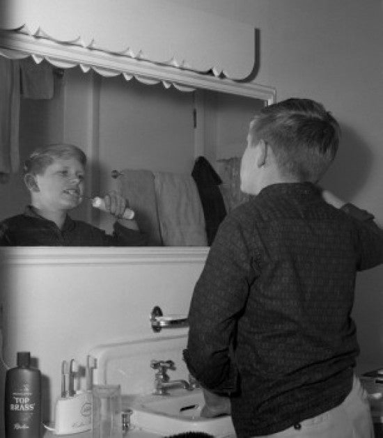 Boy Brushing Teeth with Electric Toothbrush Fine Art Print