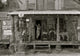 African American and White Store Owner on Country Store Porch Poster Print