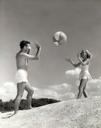 Young Couple Playing with a Beach Ball Fine Art Print