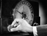 Man Adjusting the Knob of a Radio Fine Art Print