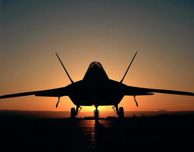 Silhouette of a F-22 Raptor Fine Art Print by Stocktrek Images