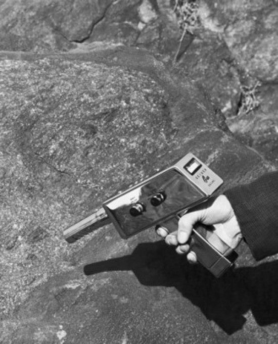 Close-Up of a Man's Hand Searching for Uranium - 1955 Poster Print