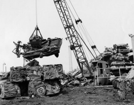 Crane Carrying a Damaged Car at a Junkyard Fine Art Print