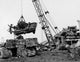 Crane Carrying a Damaged Car at a Junkyard Fine Art Print