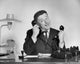 Businessman Using Two Telephones Fine Art Print
