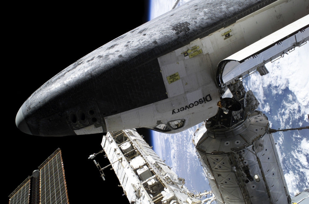 Space Shuttle Discovery Docked to International Space Station Poster Print