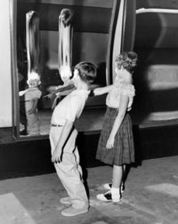 Profile of Boy and Girl Looking in Fun House Mirror Poster Print