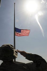 An Airman Salutes the American Flag - Fine Art Print