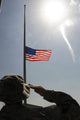 An Airman Salutes the American Flag - Fine Art Print